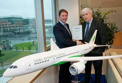 Peter Barrett, CEO, SMBC Aviation Capital receiving the M&A Deal of the Year from Ken O'Brien, editor, <i>Finance Dublin</i>.