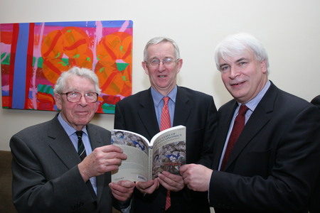 Prof. Louden Ryan (L-R) pictured in 2009 at the launch of Antoin E. Murphy's book <i>The Genesis of Macroeconomics</i> in Trinity College, and Ken O'Brien, Editor, <i>Finance Dublin</i>